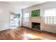 Living room featuring hardwood floors, a fireplace, and natural light at 183 Birnamwood Dr, Chapel Hill, NC 27516