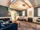 Inviting living room features a fireplace, cozy seating, high ceilings, and an artistic rug at 183 Birnamwood Dr, Chapel Hill, NC 27516