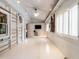 Spacious, bright room with all-white walls and floors, featuring unique architectural details and ample natural light at 183 Birnamwood Dr, Chapel Hill, NC 27516