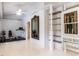 Versatile room with exercise equipment, natural light, and built-in shelving units, perfect for a home gym at 183 Birnamwood Dr, Chapel Hill, NC 27516