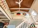Bright staircase with a ceiling fan and vibrant artwork on the walls leading to the upper level at 183 Birnamwood Dr, Chapel Hill, NC 27516