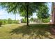 A view of the spacious backyard featuring an above-ground pool and storage shed at 1852 Gwyn Rd, Burlington, NC 27217