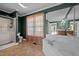 Bright bathroom boasting a separate glass shower and a large soaking tub near a window at 1852 Gwyn Rd, Burlington, NC 27217