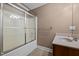 Full bathroom with a shower/tub combo and a single sink vanity with a brown cabinet at 1852 Gwyn Rd, Burlington, NC 27217