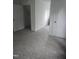 Spacious bedroom with neutral carpet, white walls, and multiple doors at 1852 Gwyn Rd, Burlington, NC 27217