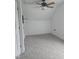 This bedroom has neutral carpeting, a ceiling fan, and a small storage area at 1852 Gwyn Rd, Burlington, NC 27217