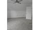 Bonus room features neutral carpet, white walls and ceiling, and storage closets in the eaves at 1852 Gwyn Rd, Burlington, NC 27217