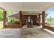 Spacious covered patio featuring brick pillars and concrete flooring at 1852 Gwyn Rd, Burlington, NC 27217