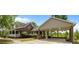 Exterior view highlights a brick house with a covered parking area and a covered porch, perfect for outdoor living at 1852 Gwyn Rd, Burlington, NC 27217