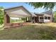 Back exterior showcasing brick home with an elegant covered patio at 1852 Gwyn Rd, Burlington, NC 27217