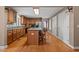 Well-lit kitchen with wooden cabinets, a spacious island, and stainless steel appliances at 1852 Gwyn Rd, Burlington, NC 27217