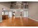 Open-concept living room featuring hardwood floors, neutral paint and a wrought-iron balcony at 1852 Gwyn Rd, Burlington, NC 27217