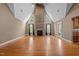 Bright living room with vaulted ceilings, stone fireplace, and hardwood floors, offering a spacious and inviting atmosphere at 1852 Gwyn Rd, Burlington, NC 27217