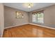 Bright room with hardwood floors, neutral paint, and natural light from the window at 1852 Gwyn Rd, Burlington, NC 27217