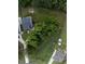 Aerial view of the property showcases the home's location, spacious yard, mature trees, and neighborhood layout at 20 Scotland Dr, Youngsville, NC 27596