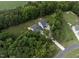 Aerial view of the property with spacious lots and mature trees showcases home's location within the neighborhood at 20 Scotland Dr, Youngsville, NC 27596