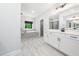 Gorgeous bathroom featuring a double vanity, a tub, and a glass-enclosed shower at 20 Scotland Dr, Youngsville, NC 27596