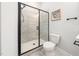Modern bathroom featuring a glass-enclosed shower, tile floor, and contemporary fixtures at 20 Scotland Dr, Youngsville, NC 27596