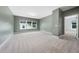 Neutral paint and carpet in this bedroom with large windows offering plenty of natural light at 20 Scotland Dr, Youngsville, NC 27596