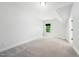 Bright bedroom featuring carpeted floors and a window with natural light at 20 Scotland Dr, Youngsville, NC 27596