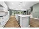 Spacious kitchen with white cabinets, stainless steel appliances, and a large center island at 20 Scotland Dr, Youngsville, NC 27596