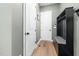 Mudroom with convenient storage, including a coat rack, bench, and storage cabinets at 20 Scotland Dr, Youngsville, NC 27596