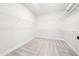 Spacious walk-in closet with ample shelving and carpet, providing plenty of room for storage at 20 Scotland Dr, Youngsville, NC 27596