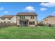 Large, well-maintained backyard featuring a screened-in porch and wood fence at 2018 Morehead Hill Ct, Durham, NC 27703