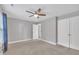 Spacious bedroom with neutral walls and carpet, featuring a ceiling fan and closet at 2018 Morehead Hill Ct, Durham, NC 27703