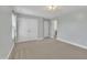 Neutral-toned bedroom features carpet, double closets, and an en-suite door for ease and convenience at 2018 Morehead Hill Ct, Durham, NC 27703