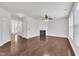 Bright living room features a fireplace, ceiling fan, and wood-look flooring at 2018 Morehead Hill Ct, Durham, NC 27703