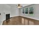 Bright living room with hardwood floors, fireplace and large windows overlooking the backyard at 2018 Morehead Hill Ct, Durham, NC 27703
