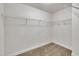 Empty walk-in closet featuring white walls, neutral carpet, and wire shelving around the perimeter at 2018 Morehead Hill Ct, Durham, NC 27703