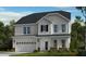 Charming two-story home featuring a two-car garage and a welcoming covered front porch at 204 Hickory Grove St, Sanford, NC 27330