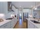 Stylish kitchen with modern appliances, white cabinets, and a functional layout, perfect for cooking and entertaining at 204 Hickory Grove St, Sanford, NC 27330
