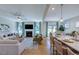 Open-concept living space with a fireplace, dining area, and kitchen island, perfect for entertaining and Gathering life at 204 Hickory Grove St, Sanford, NC 27330
