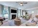 Inviting living room with a cozy fireplace and large windows, offering a bright and comfortable space at 204 Hickory Grove St, Sanford, NC 27330