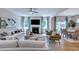 Spacious living room featuring a fireplace, comfortable seating, and an adjacent dining area, ideal for gatherings at 204 Hickory Grove St, Sanford, NC 27330