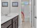 Bathroom featuring double vanity and tub/shower combo at 208 Cecelia Ct, Cary, NC 27519