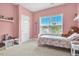 Pink bedroom featuring a twin bed, a window, and a cozy, inviting ambiance at 208 Cecelia Ct, Cary, NC 27519