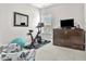 Bright bedroom featuring exercise equipment, including stationary bike and fitness ball at 208 Cecelia Ct, Cary, NC 27519