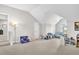 Spacious bonus room features neutral carpeting, ample natural light, and versatile layout for various activities at 208 Cecelia Ct, Cary, NC 27519
