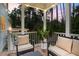 Relaxing covered deck with comfortable seating and string lights, perfect for outdoor enjoyment at 208 Cecelia Ct, Cary, NC 27519