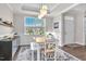 Bright dining room with natural light, a wooden table with chairs, and stylish decor at 208 Cecelia Ct, Cary, NC 27519