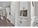 Bright kitchen with white cabinetry, stainless appliances, ample counter space, and an exterior view at 208 Cecelia Ct, Cary, NC 27519