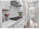 Bright kitchen features white cabinets, subway tile backsplash, and stainless steel range at 208 Cecelia Ct, Cary, NC 27519