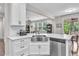 Spacious kitchen with stainless steel appliances, undermount sink, and granite countertops at 208 Cecelia Ct, Cary, NC 27519
