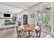 Open concept living room with sliding door to patio and fireplace at 208 Cecelia Ct, Cary, NC 27519