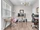 Bright home office featuring modern decor, hardwood floors, and functional workspace at 208 Cecelia Ct, Cary, NC 27519