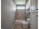 A well-lit bathroom with a tiled shower-tub combo and ample storage offers a clean and functional design at 2109 Taramar Ln, Zebulon, NC 27597